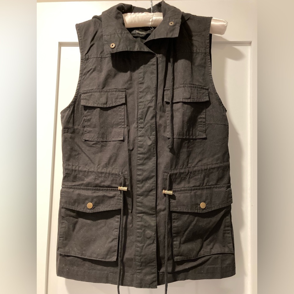 Woman’s Black, hooded, utilitarian vest.